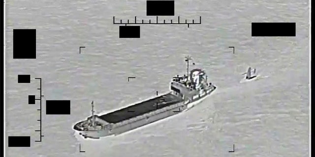 This photo released by the U.S. Navy shows the Iranian Revolutionary Guard ship Shahid Bazair, left, towing a U.S. Navy Saildrone Explorer in the Persian Gulf Tuesday, Aug. 30, 2022. 