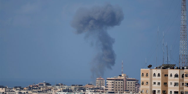 Smoke rises following Israeli airstrikes on a building in Gaza City, Saturday, Aug. 6, 2022.