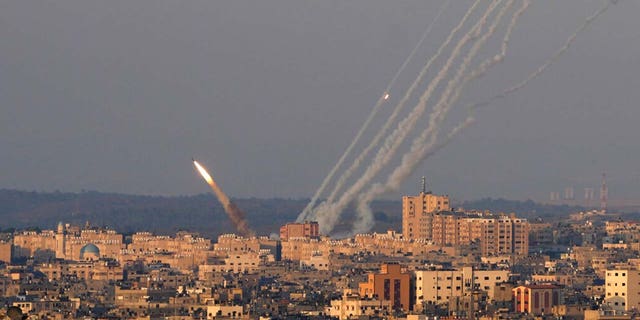 Rockets are launched from the Gaza Strip towards Israel, in Gaza City, Sunday, Aug. 7, 2022.