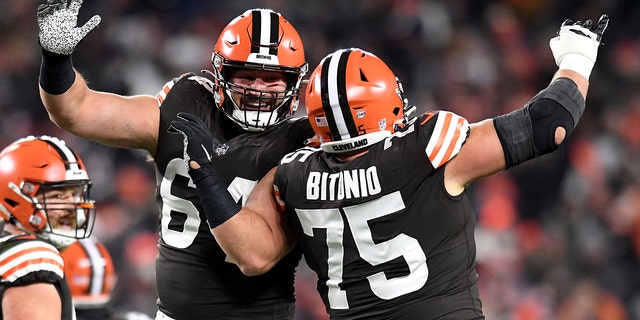 JC Tretter and Joel Bitonio of the Cleveland Browns celebrate after a touchdown in the second half of their game against the Las Vegas Raiders at FirstEnergy Stadium in Cleveland, Ohio, on Dec. 20, 2021.