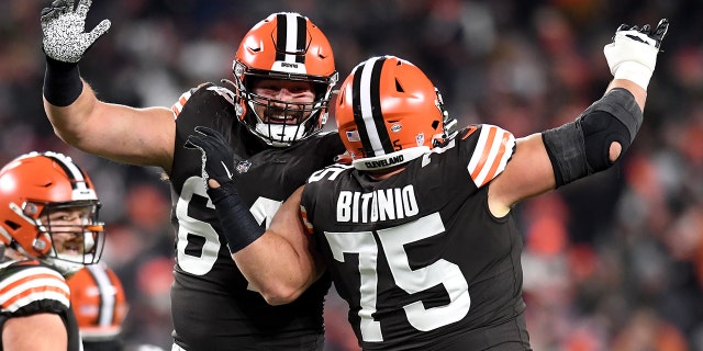 JC Tretter and Joel Bitonio of the Cleveland Browns celebrate after a touchdown in the second half of their game against the Las Vegas Raiders at FirstEnergy Stadium in Cleveland, Ohio, on Dec. 20, 2021.