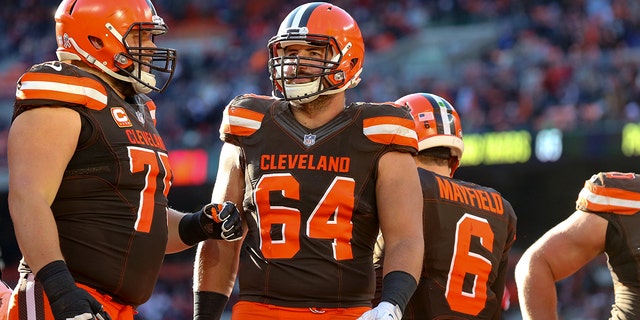 Cleveland Browns guard Joel Bitonio, left, and center JC Tretter regroup during a game against the Atlanta Falcons at FirstEnergy Stadium in Cleveland, Ohio, on Nov. 11, 2018.