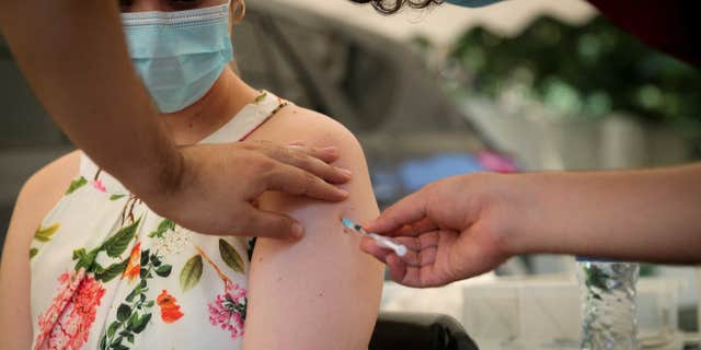 The J&J vaccine has been coincidentally linked to a death for the first time in South Africa. Pictured: A health worker administers a dose of the coronavirus vaccine in Johannesburg, South Africa on December 4, 2021.