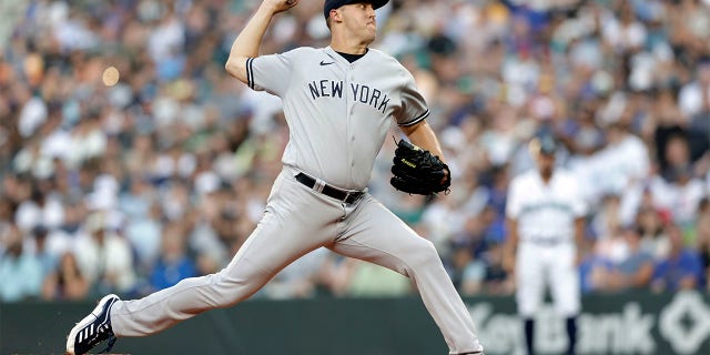 New York Yankees starting pitcher Jameson Taillon works against the Seattle Mariners during the first inning of a baseball game, Monday, Aug. 8, 2022, in Seattle.