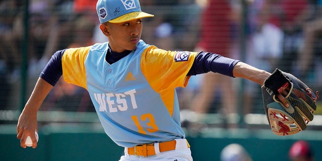 Honolulu's Jaron Lancaster delivers in the first inning of the Little League World Series championship game against Curacao in South Williamsport, Pennsylvania, on Aug. 28, 2022.