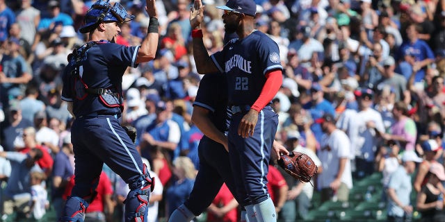 Yan Gomes and Jason Heyward of the Cubs celebrate after they defeated the Atlanta Braves 1-0 at Wrigley Field on June 17, 2022, in Chicago.