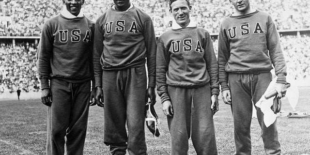 Members of the American relay team that won the 400-meter relay race at the Olympics in Berlin. They bettered the world and the Olympic records at 0:39.8 seconds. Left to right: Jesse Owens, Ralph Metcalfe, Foy Draper and Frank Wykoff on Aug. 18, 1936.
