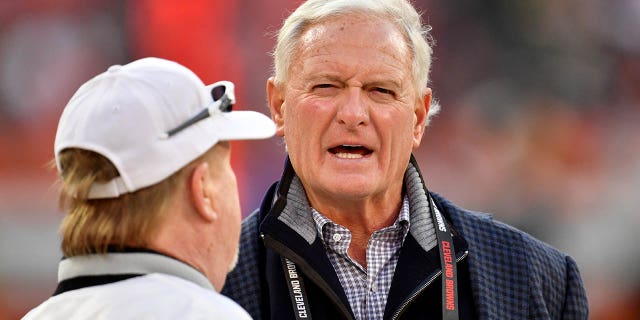 Las Vegas Raiders owner Mark Davis, left, and Cleveland Browns owner Jimmy Haslam talk before a game Dec. 20, 2021, at FirstEnergy Stadium in Cleveland.