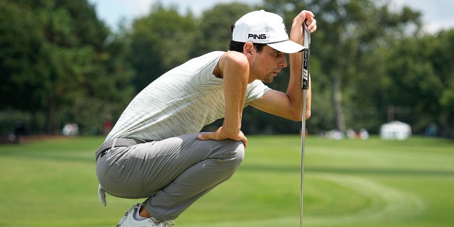 Joaquin Niemann, of Chile, lines up a putt on the third green during the second round of the Tour Championship golf tournament at East Lake Golf Club, Friday, Aug. 26, 2022, in Atlanta.