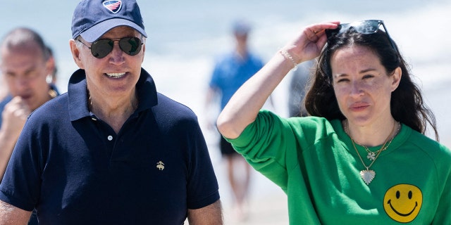 President Biden walks on the beach with his daughter, Ashley Biden, in Rehoboth Beach, Delaware, June 20, 2022.