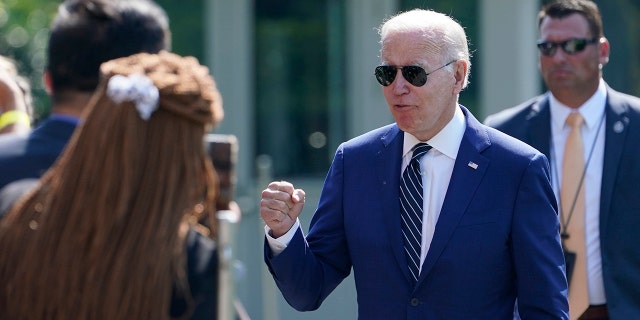 President Biden greets people after returning to the White House in Washington, Wednesday, Aug. 24, 2022.