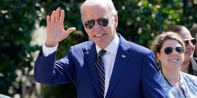 President Biden waves after returning to the White House in Washington to announce his student loan forgiveness plan on Aug. 24, 2022.