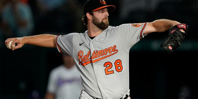 Baltimore Orioles starting pitcher Jordan Lyles throws to the Texas Rangers in th first inning of a baseball game, Tuesday, Aug. 2, 2022, in Arlington, Texas.