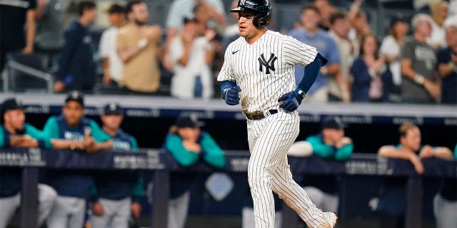 New York Yankees' Jose Trevino runs the bases after hitting a home run during the eighth inning of a baseball game against the Seattle Mariners, Monday, Aug. 1, 2022, in New York.