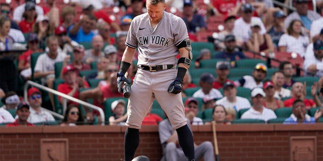 New York Yankees' Josh Donaldson drops his batting helmet after being called out on strikes to end the top of the seventh inning of a baseball game against the St. Louis Cardinals Sunday, Aug. 7, 2022, in St. Louis.