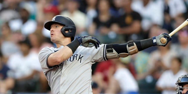 New York Yankees' Josh Donaldson watches his solo home run off a pitch by Seattle Mariners starter Logan Gilbert during the third inning of a baseball game, Monday, Aug. 8, 2022, in Seattle.