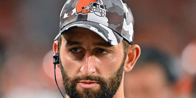 Quarterback Josh Rosen, #19 of the Cleveland Browns, listens to a teammate while on the sidelines during the third quarter of a preseason game against the Chicago Bears at FirstEnergy Stadium on August 27, 2022 in Cleveland.