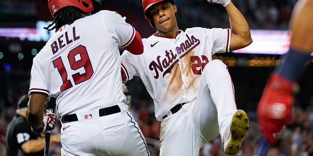 Washington Nationals' Juan Soto, right, celebrates with Josh Bell after his solo home run during the fourth inning of a baseball game against the New York Mets at Nationals Park, Monday, Aug. 1, 2022, in Washington, D.C. 