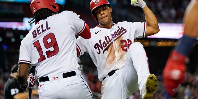 Washington Nationals' Juan Soto, right, celebrates with Josh Bell after his solo home run during the fourth inning of a baseball game against the New York Mets at Nationals Park, Monday, Aug. 1, 2022, in Washington, D.C.