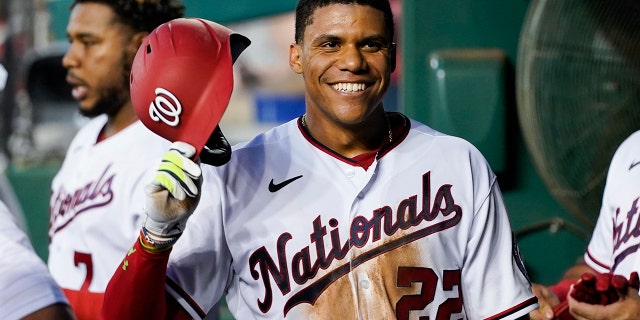 Juan Soto smiles as he celebrates after his solo home against the New York Mets at Nationals Park, Monday, Aug. 1, 2022, in Washington.