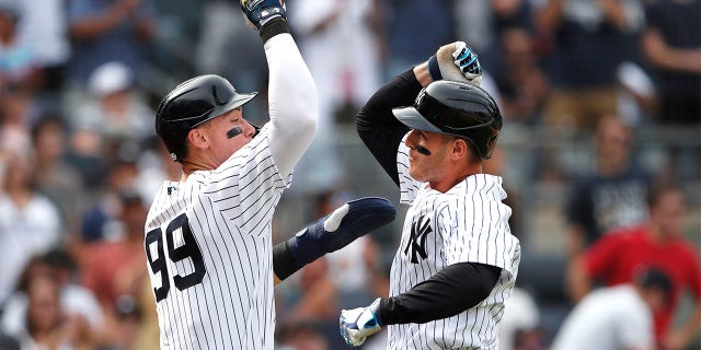 New York Yankees' Aaron Judge (99) celebrates with Anthony Rizzo, right, after Rizzo's home run against the Kansas City Royals during the seventh inning of a baseball game Sunday, July 31, 2022, in New York.