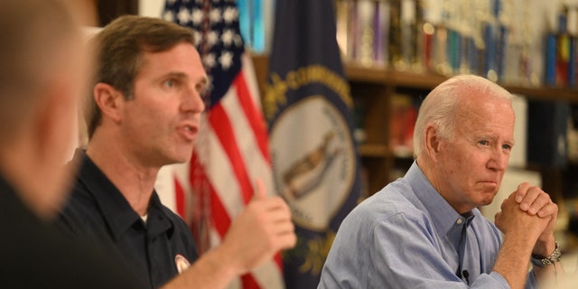 President Biden (R) listens to Kentucky Gov. Andy Beshear speak during a briefing on the ongoing response efforts to the recent flooding at Marie Roberts Elementary School, in Lost Creek, Kentucky on Aug. 8, 2022. 