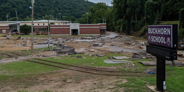 Debris surrounds Buckhorn school, which was badly damaged during historic flooding, in Buckhorn, Kentucky, on July 31, 2022. 