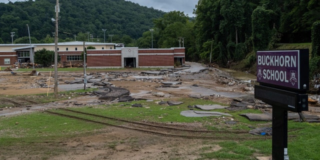 Debris surrounds Buckhorn school, which was badly damaged during historic flooding, in Buckhorn, Kentucky, on July 31, 2022.