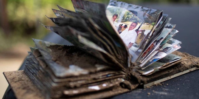 A photo album is covered in mud from Kentucky flooding on Saturday, July 30, 2022. 
