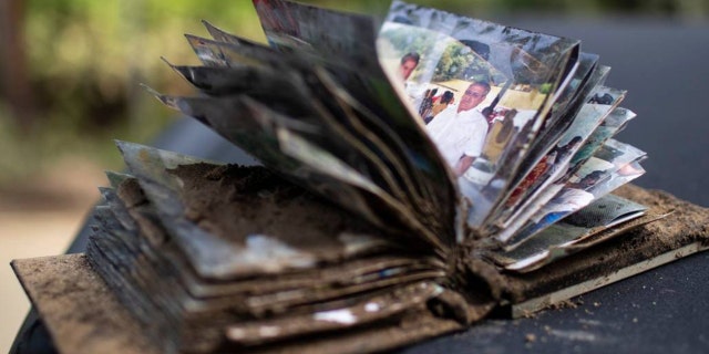 document your loved ones’s historical past and protect reminiscences 2 A photo album is covered in mud from Kentucky flooding on Saturday, July 30, 2022.