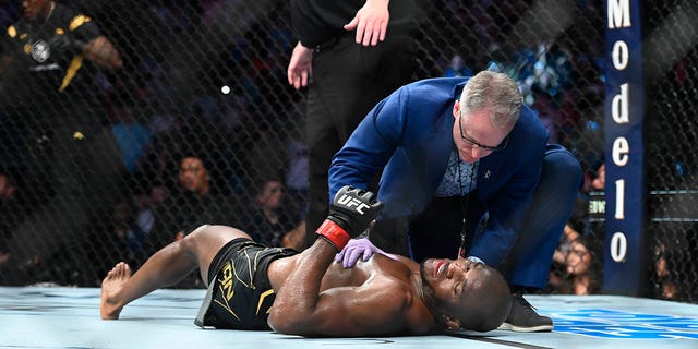 Kamaru Usman on the mat after being knocked out by Leon Edwards on Aug. 20, 2022, in Salt Lake City, Utah.