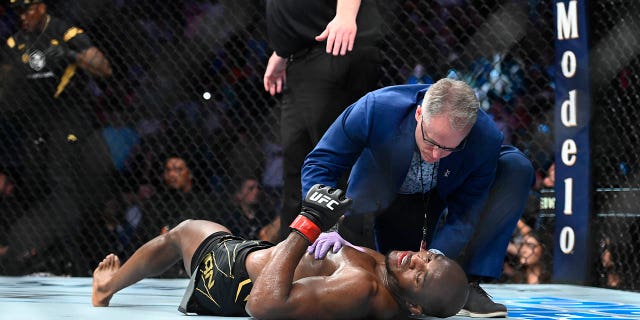 Kamaru Usman on the mat after being knocked out by Leon Edwards on Aug. 20, 2022, in Salt Lake City, Utah.