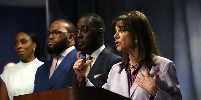 Miami-Dade State Attorney Katherine Fernandez Rundle at a press conference April 3, 2022, announcing a murder charge against influencer Courtney Clenney, 26, for the slaying of her boyfriend Christian Obumseli. Rundle stands next to the family's lawyer Larry Handfield and the victim's brother, Jeff Obumseli.