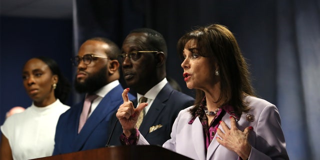 Miami-Dade State Attorney Katherine Fernandez Rundle at a press conference April 3, 2022, announcing a murder charge against influencer Courtney Clenney, 26, for the slaying of her boyfriend Christian Obumseli. Rundle stands next to the family's lawyer Larry Handfield and the victim's brother, Jeff Obumseli.