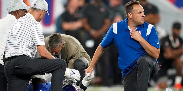 Trainers check on New York Giants defensive end Kayvon Thibodeaux after he was injured during the first half of a preseason NFL football game against the Cincinnati Bengals, Sunday, Aug. 21, 2022, in East Rutherford, N.J.