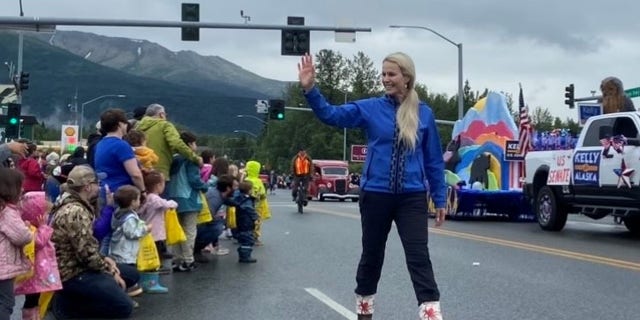 Republican Senate candidate Kelly Tshibaka marches in the Bear Paw Parade in Eagle River, Alaska on July 16, 2022.
