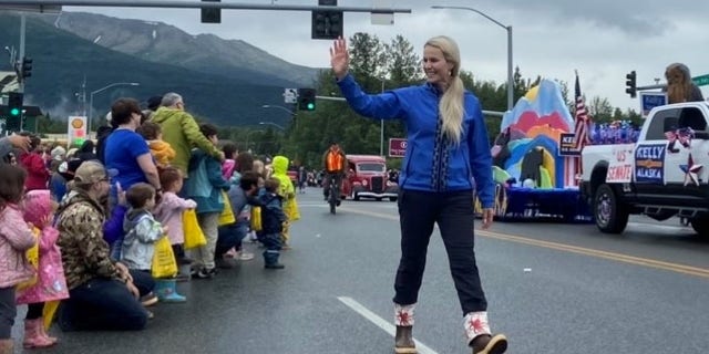 Republican Senate candidate Kelly Tshibaka marches in the Bear Paw Parade in Eagle River, Alaska on July 16, 2022.