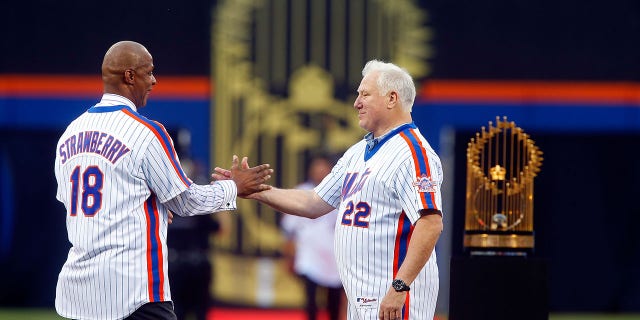 Former teammates Ray Knight (22) and Darryl Strawberry (18) greet one another during the 1986 New York Mets 30th anniversary reunion celebration at Citi Field in New York City on May 28, 2016.