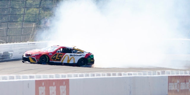 Kurt Busch's No. 45 car spins during qualifying for the NASCAR Cup Series at Pocono Raceway July 23, 2022, in Long Pond, Pa.