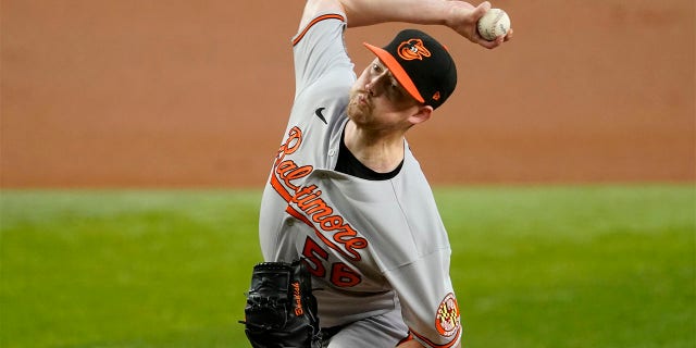 Baltimore Orioles starting pitcher Kyle Bradish throws to the Texas Rangers in the first inning of a baseball game, Wednesday, Aug. 3, 2022, in Arlington, Texas.