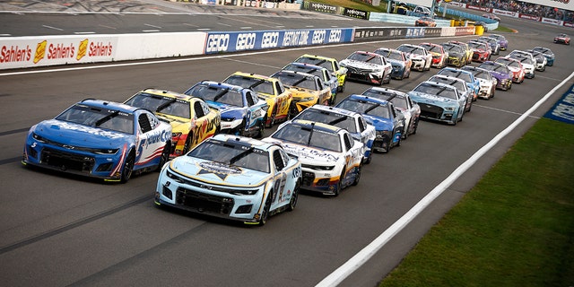 Cars line up for the NASCAR Cup Series Go Bowling at The Glen at Watkins Glen International on Aug. 21, 2022, in New York.