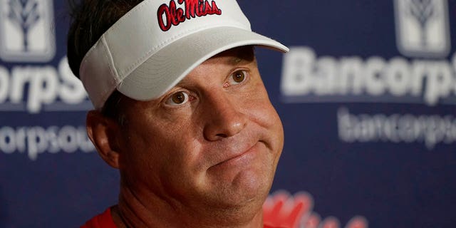 Mississippi head coach Lane Kiffin ponders a reporter's question during a news conference following an NCAA college football practice, Wednesday, Aug. 3, 2022, in Oxford, Mississippi. 