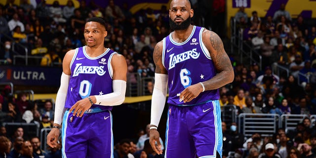 Russell Westbrook, left, and LeBron James of the Los Angeles Lakers look on during the game against the New Orleans Pelicans at Crypto.Com Arena in Los Angeles on April 1, 2022.