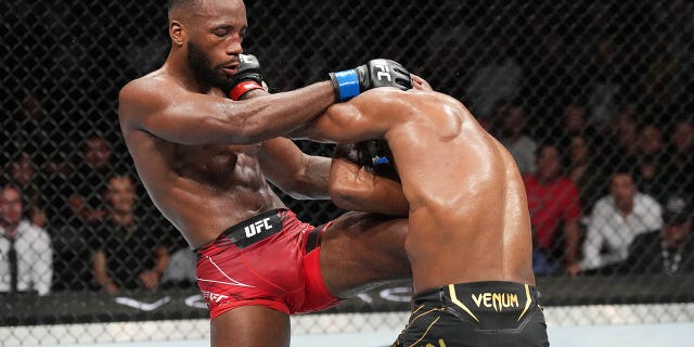 Leon Edwards knees Kamaru Usman in the UFC welterweight championship fight during the UFC 278 on Aug. 20, 2022, in Salt Lake City, Utah.