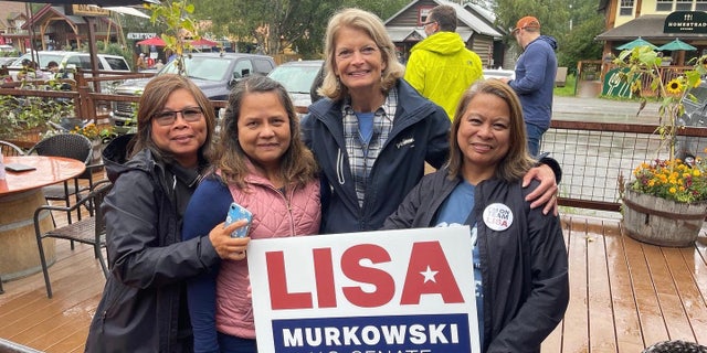 GOP Sen. Lisa Murkowski  takes a picture with supporters in Talkeetna, Alaska on August 13, 2022.