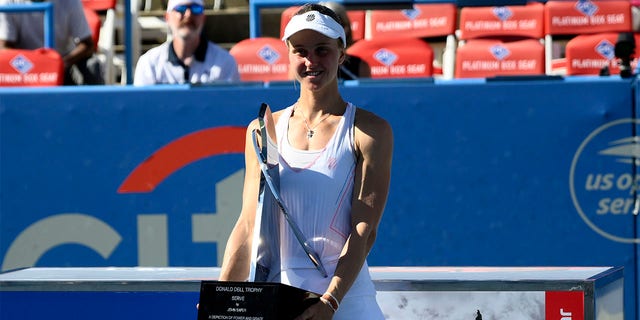 Lyudmila Samsonova of Russia poses with the trophy after winning the final against Kaia Kanepi of Estonia at the City Open tennis tournament, Sunday, Aug. 7, 2022, in Washington. 