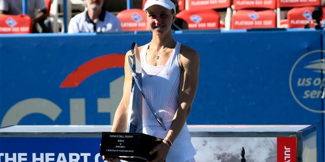 Lyudmila Samsonova of Russia poses with the trophy after winning the final against Kaia Kanepi of Estonia at the City Open tennis tournament, Sunday, Aug. 7, 2022, in Washington.
