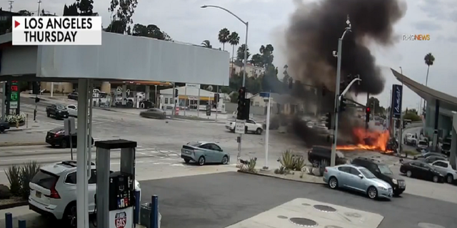 The fiery aftermath of the collision at the busy intersection of South La Brea Avenue and Slauson Avenue in the Windsor Hills area of West Los Angeles.
