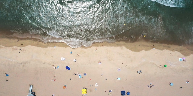 In an aerial view, people gather in the sand at Bruce's Beach on June 29, 2022, in Manhattan Beach, California.