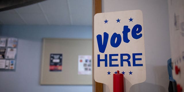A "Vote here" A sign is seen at a polling place in Birmingham, Michigan on August 1, 2022.